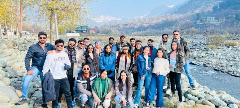 One of our travel groups by a mountain river in Kashmir